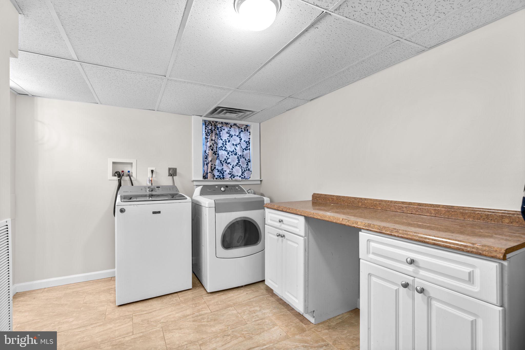 8483 Frederick Road Ellicott City, MD 21043 - Photo 33 of 44 a utility room with dryer and washer