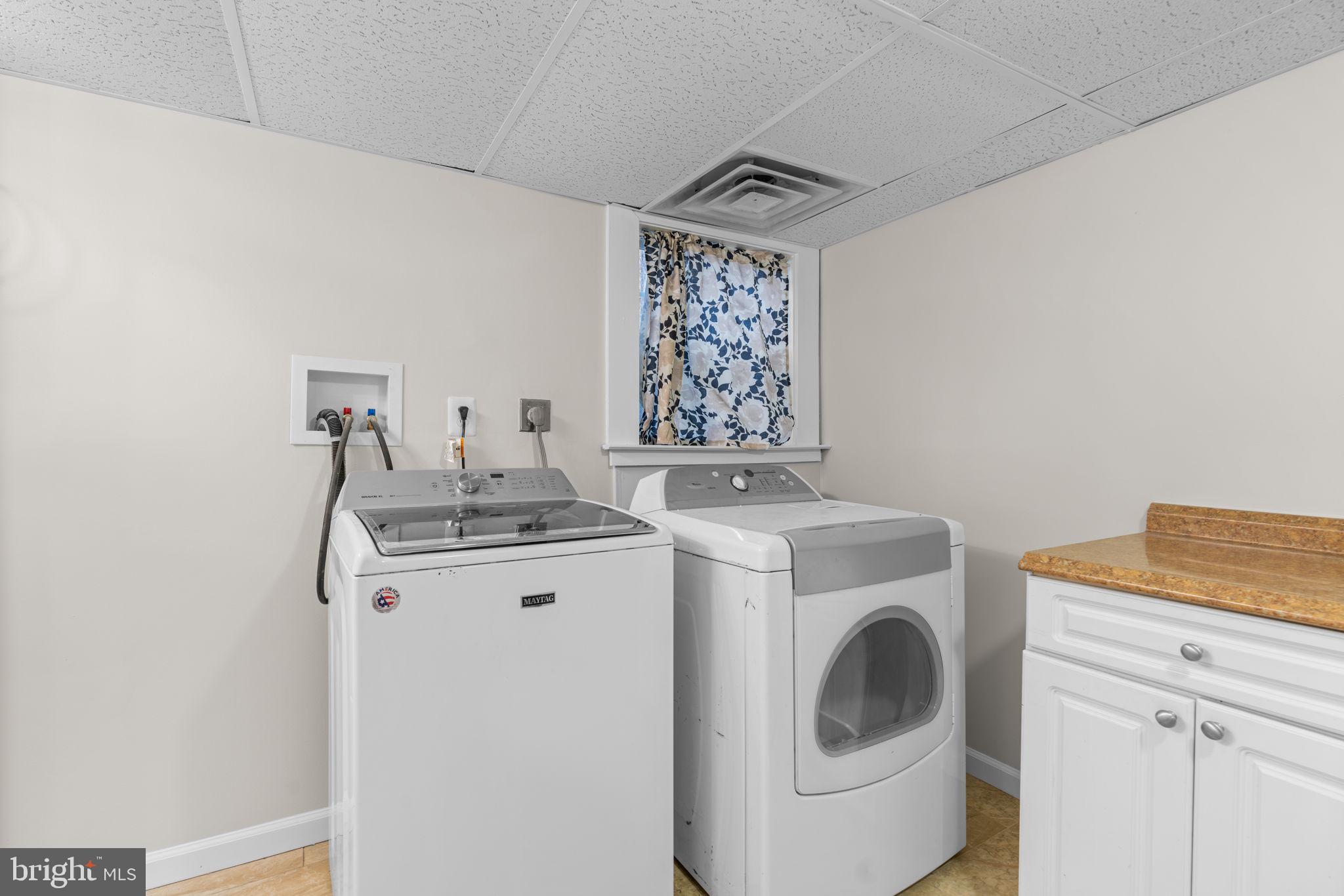 8483 Frederick Road Ellicott City, MD 21043 - Photo 35 of 44 a utility room with dryer and washer