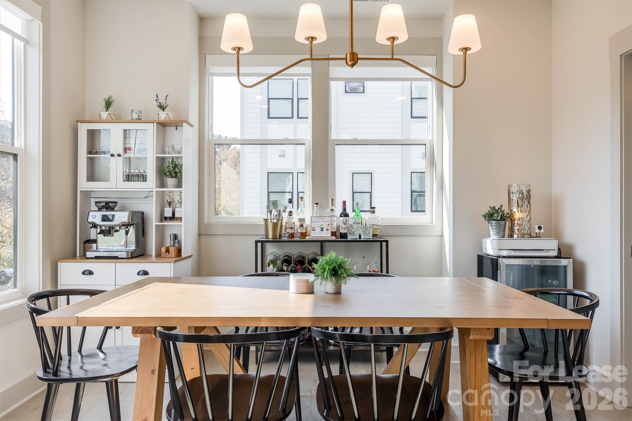 2319 Wesley Village Road Charlotte, NC 28208 - Photo 23 of 44 a dining table with chairs and view of kitchen