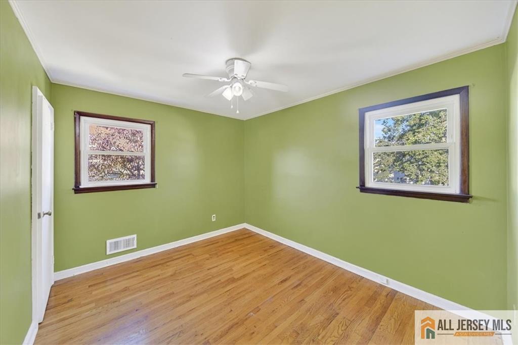 6 Dundar Road Edison, NJ 08817 - Photo 12 of 22 a view of a room with a painting on the wall