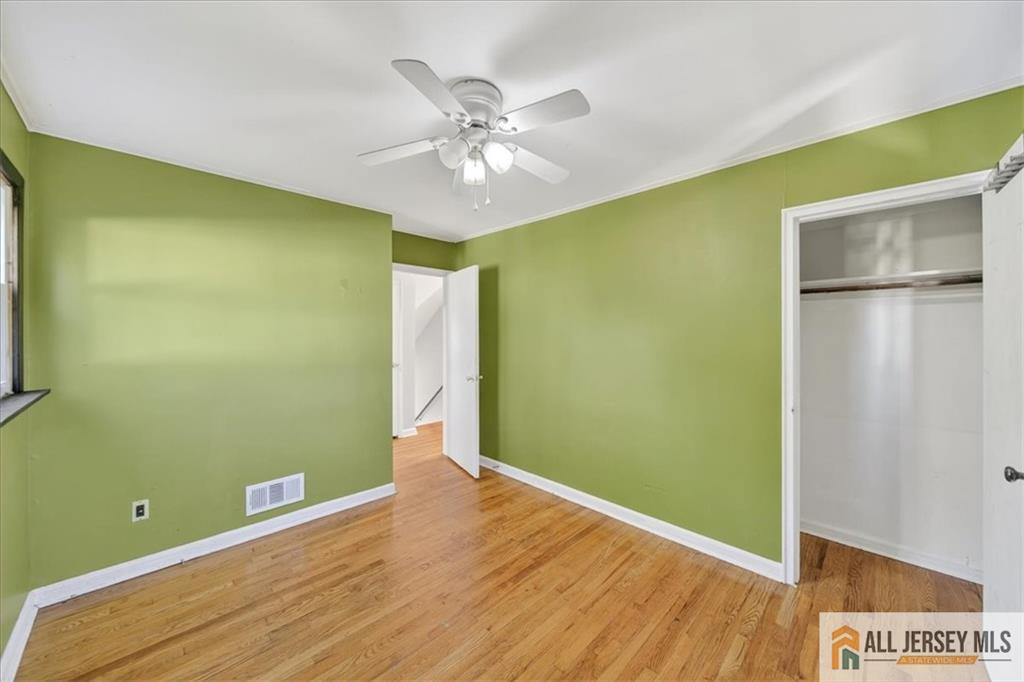 6 Dundar Road Edison, NJ 08817 - Photo 13 of 22 a view of room with wooden floor and fan