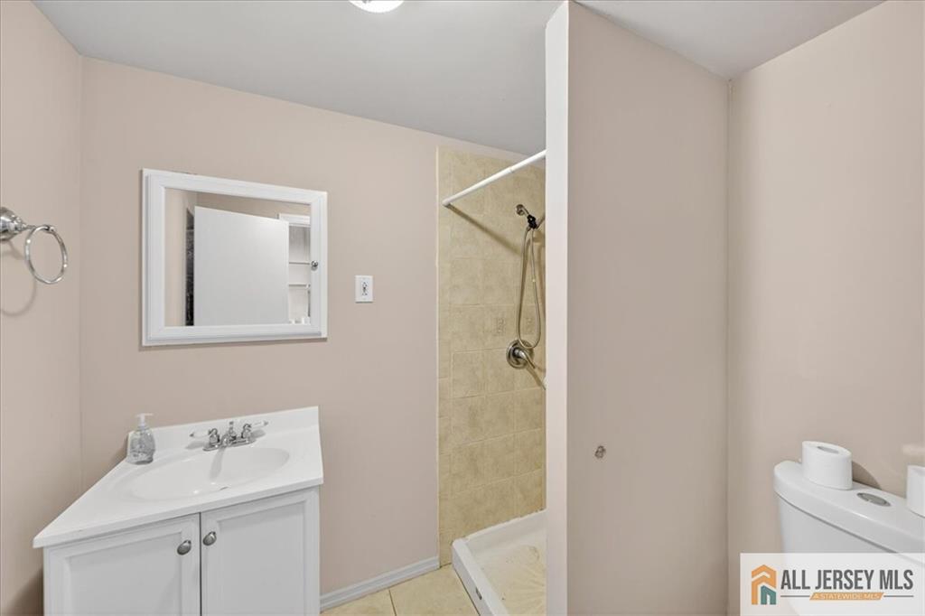 6 Dundar Road Edison, NJ 08817 - Photo 20 of 22 a bathroom with a sink and mirror