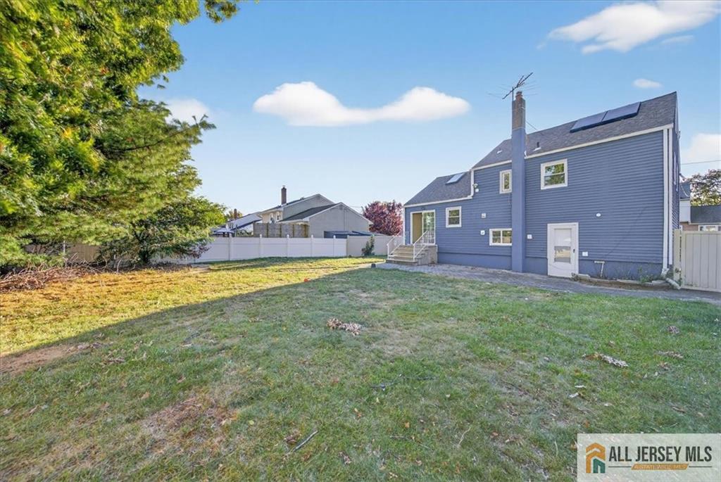 6 Dundar Road Edison, NJ 08817 - Photo 22 of 22 a view of a house with a big yard and a large tree