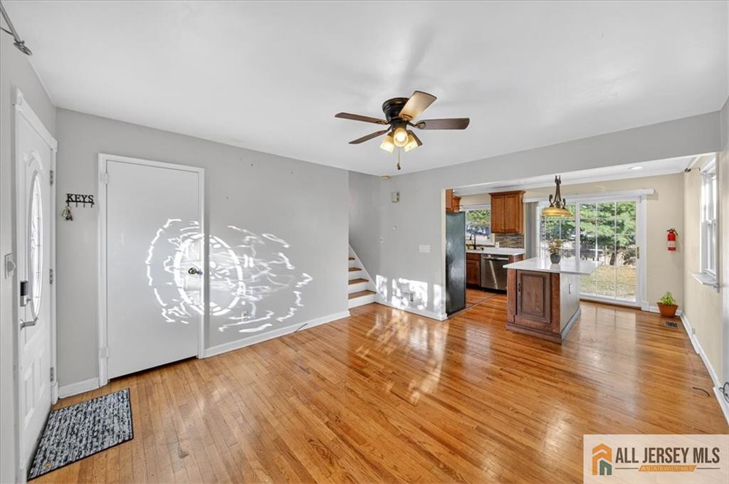 6 Dundar Road Edison, NJ 08817 - Photo 4 of 22 a view of a livingroom with furniture wooden floor and a kitchen
