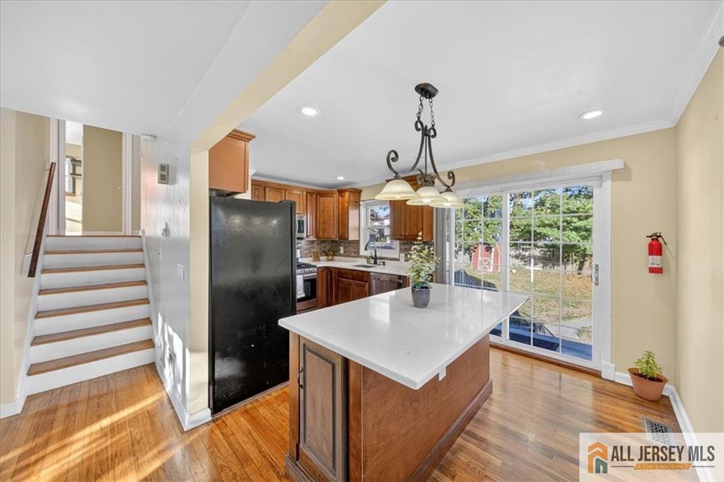 6 Dundar Road Edison, NJ 08817 - Photo 6 of 22 a kitchen with stainless steel appliances granite countertop a refrigerator and a stove