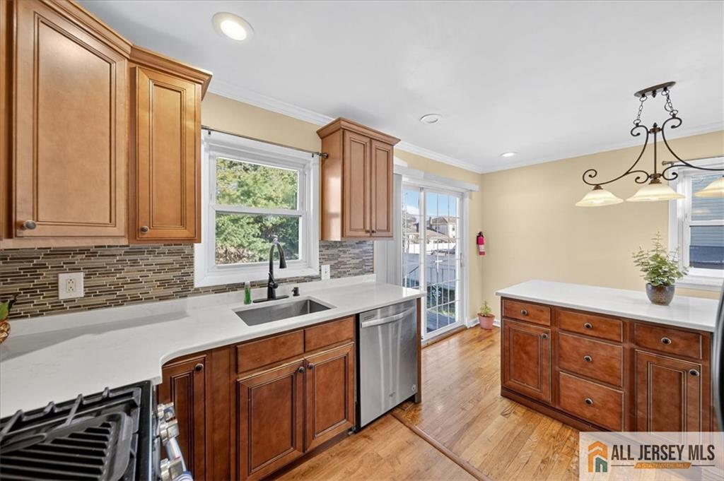 6 Dundar Road Edison, NJ 08817 - Photo 9 of 22 a kitchen with stainless steel appliances a sink stove and cabinets