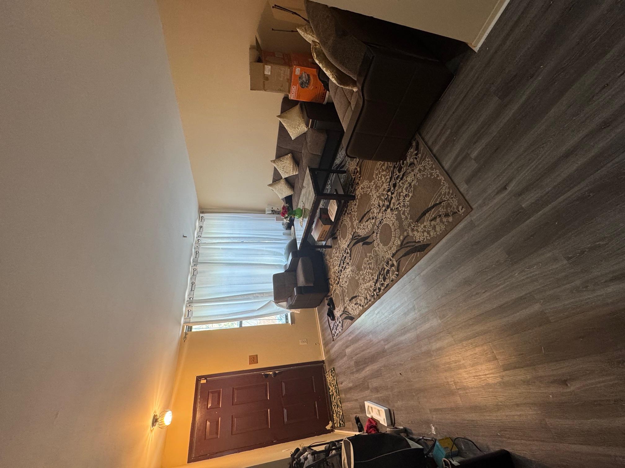 1987 Prospect Avenue Bronx, NY 10457 - Photo 2 of 13 a living room with furniture and a flat screen tv