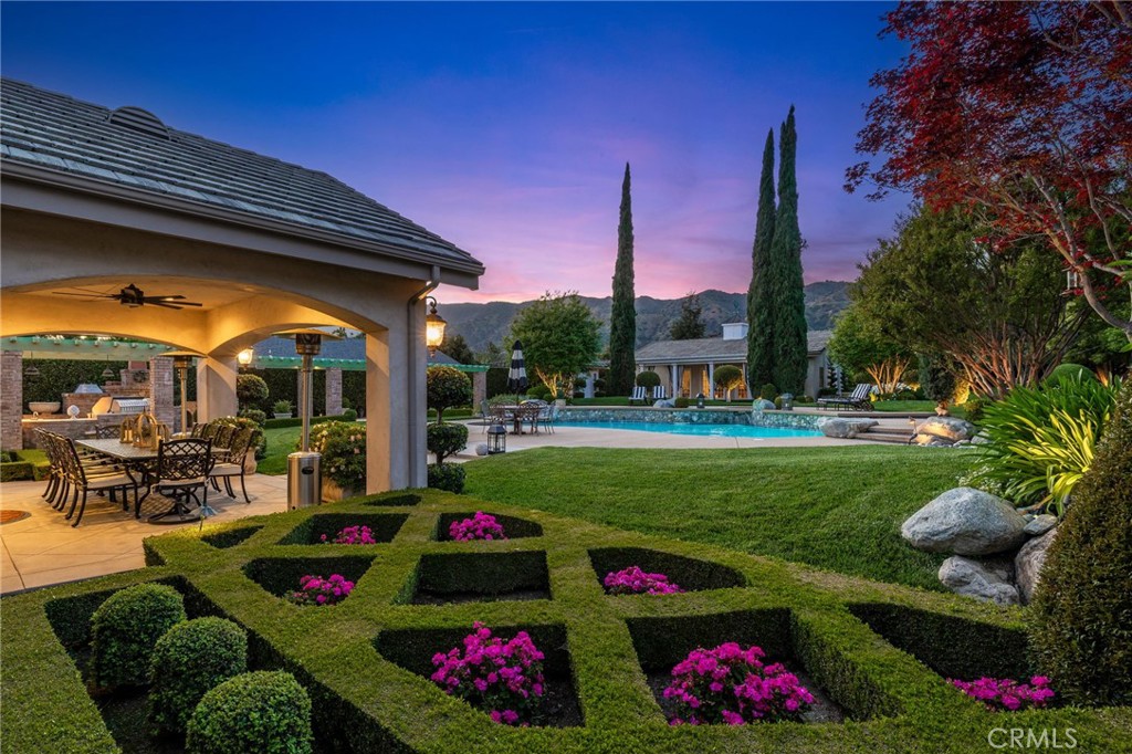 Exquisite landscaping overlooking the impeccable backyard.