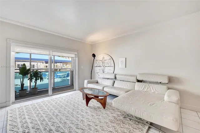 a living room with furniture a lamp and a table