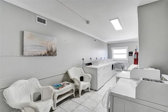 a view of a swimming pool with outdoor seating