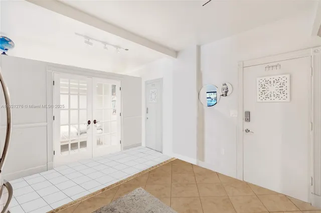 a view of a room with wooden floor and bathroom