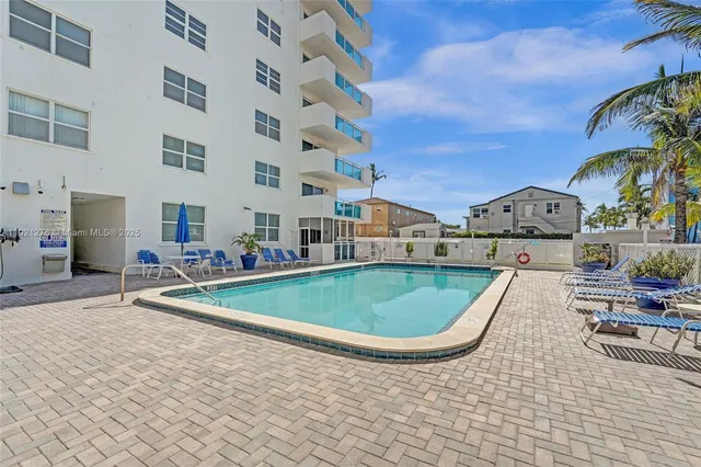 a view of a street with a building in the background