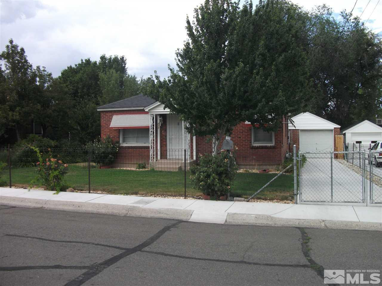 511 Toiyabe Street Reno, NV 89509 - Photo 1 of 1 a front view of house with yard and green space