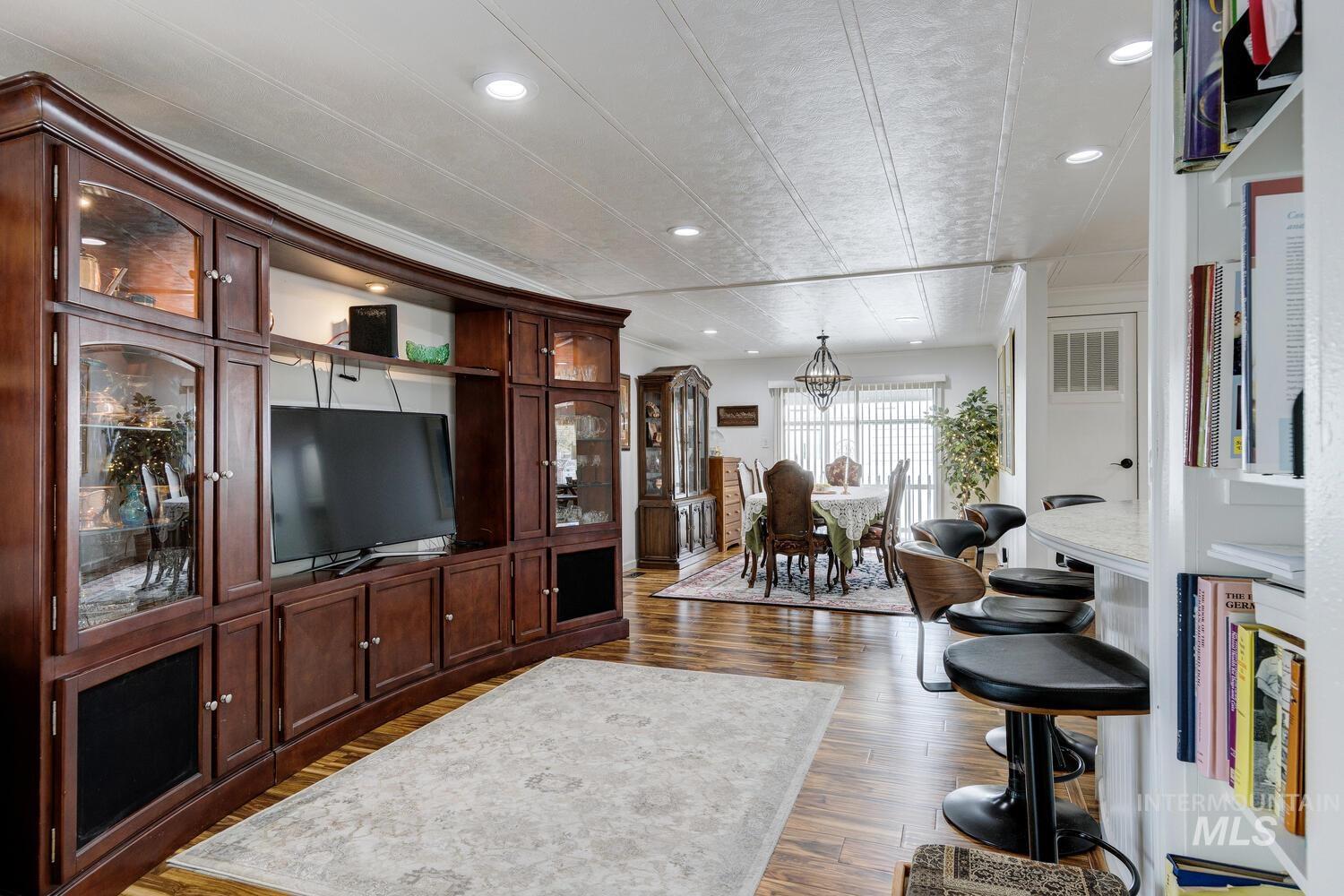 9390 West Ustick Road, Unit 64 Boise, ID 83704 - Photo 17 of 36 Living area with recessed lighting and dark wood-style floors