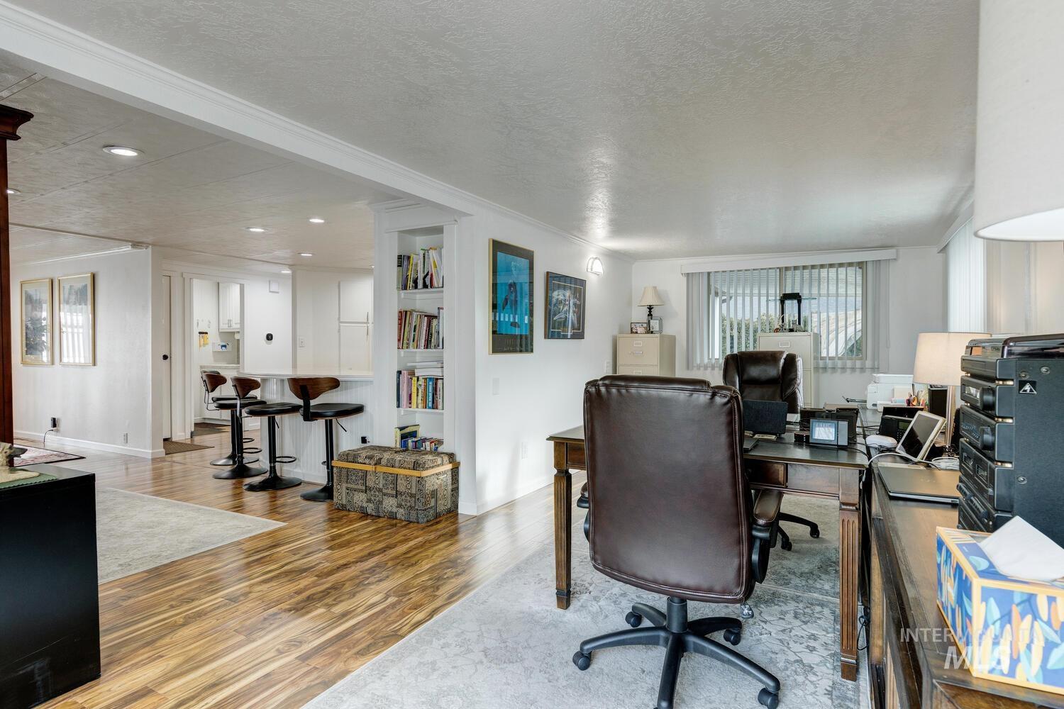 9390 West Ustick Road, Unit 64 Boise, ID 83704 - Photo 20 of 36 Office featuring a textured ceiling, wood finished floors, and recessed lighting