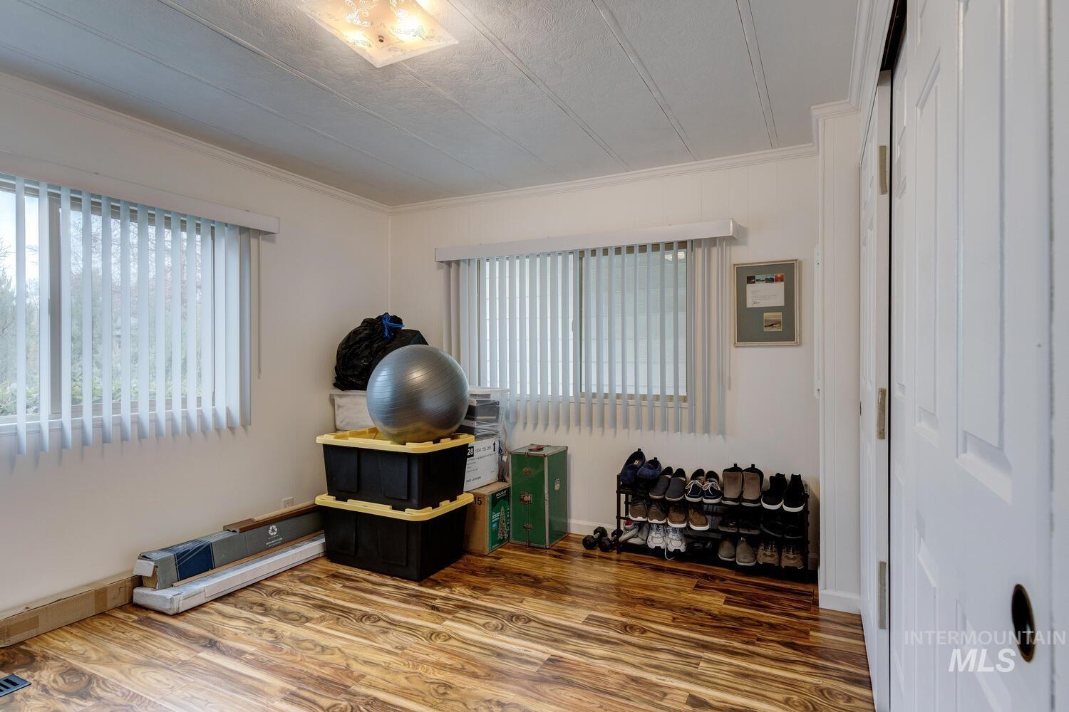 9390 West Ustick Road, Unit 64 Boise, ID 83704 - Photo 26 of 36 Workout room featuring wood finished floors and crown molding