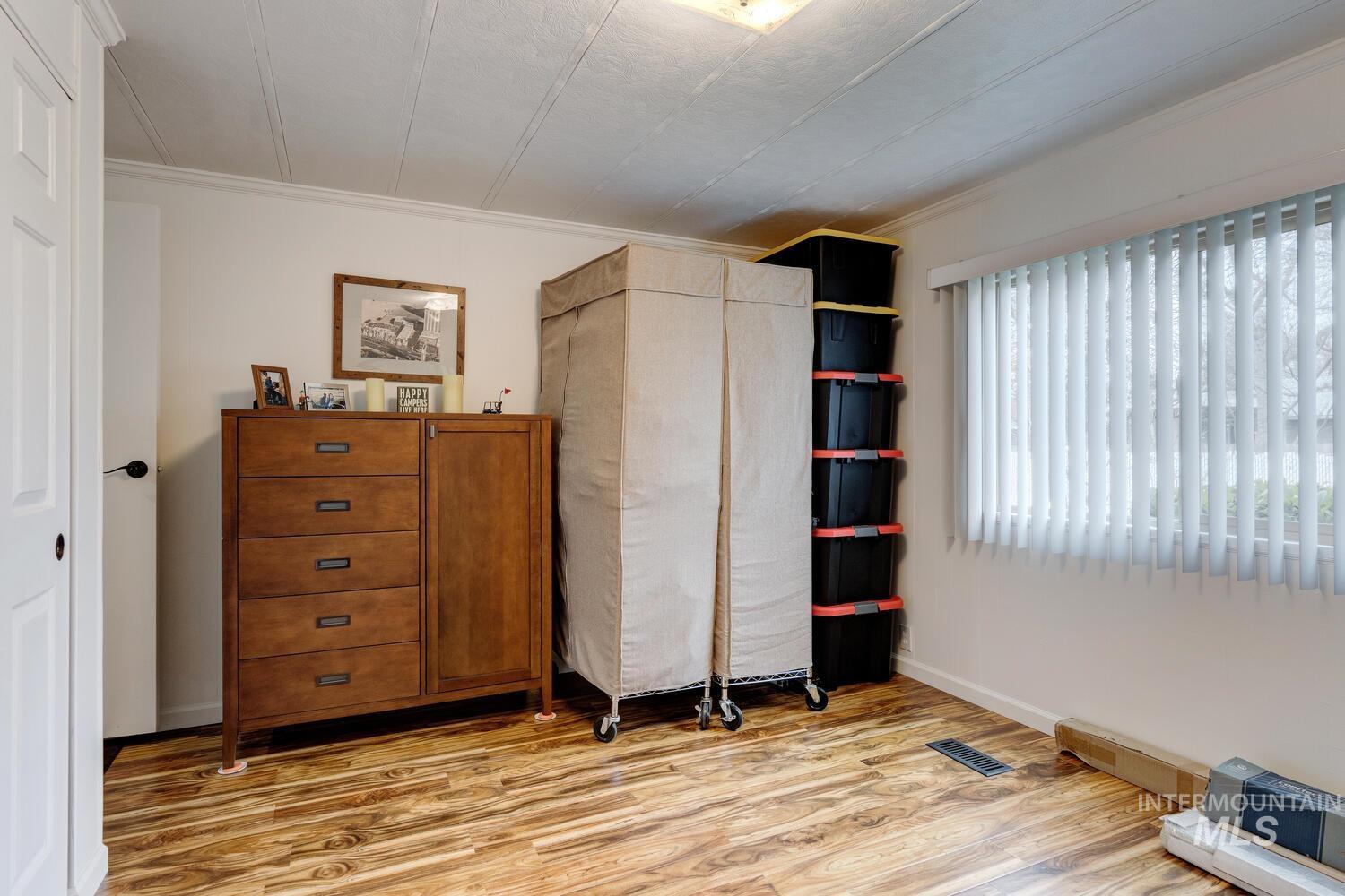 9390 West Ustick Road, Unit 64 Boise, ID 83704 - Photo 27 of 36 Bedroom featuring light wood-style flooring and a closet