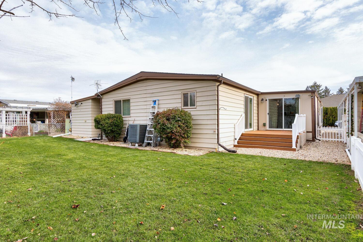 9390 West Ustick Road, Unit 64 Boise, ID 83704 - Photo 32 of 36 Back of house with a wooden deck