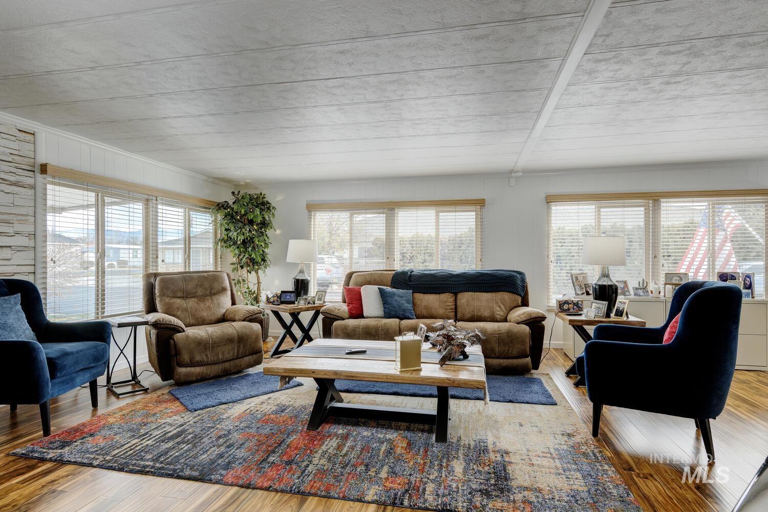 9390 West Ustick Road, Unit 64 Boise, ID 83704 - Photo 8 of 36 Living room featuring hardwood / wood-style flooring