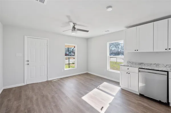 a view of a kitchen with electric appliances