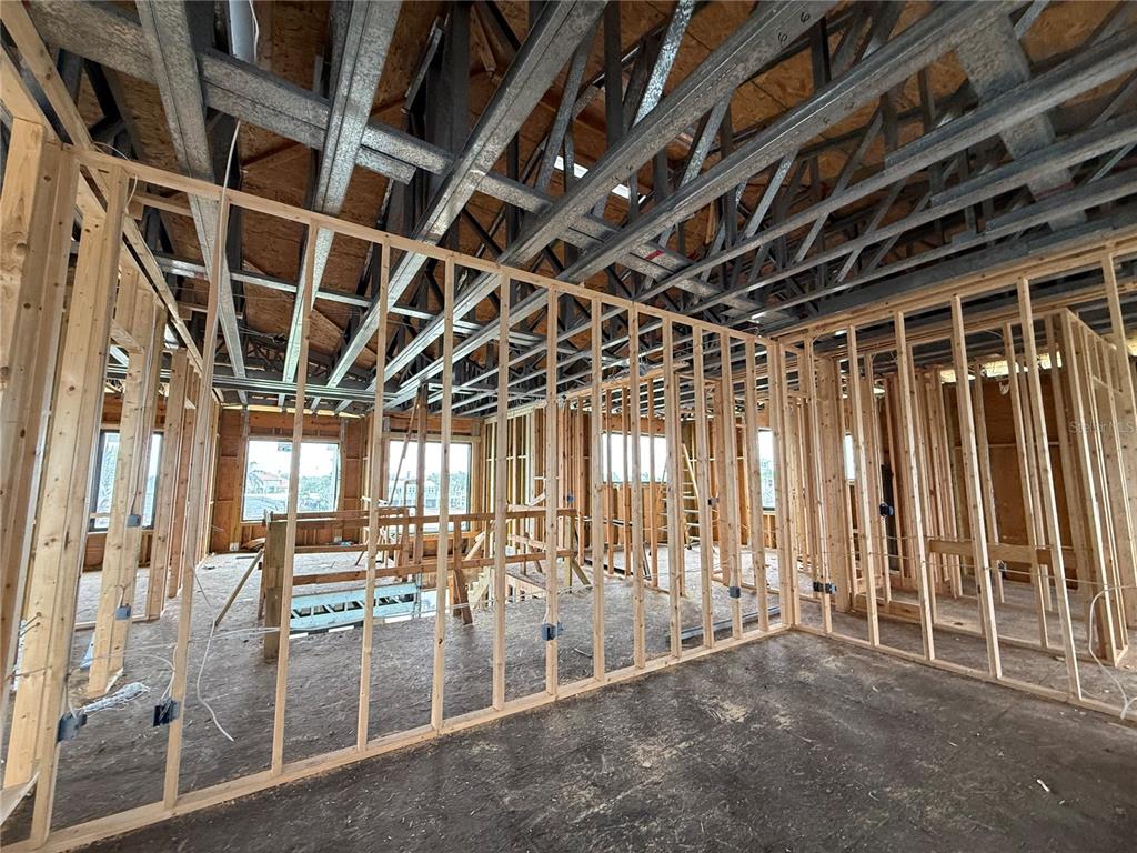234 Bangsberg Road Southeast Port Charlotte, FL 33952 - Photo 6 of 14 a view of an empty room with wooden frame