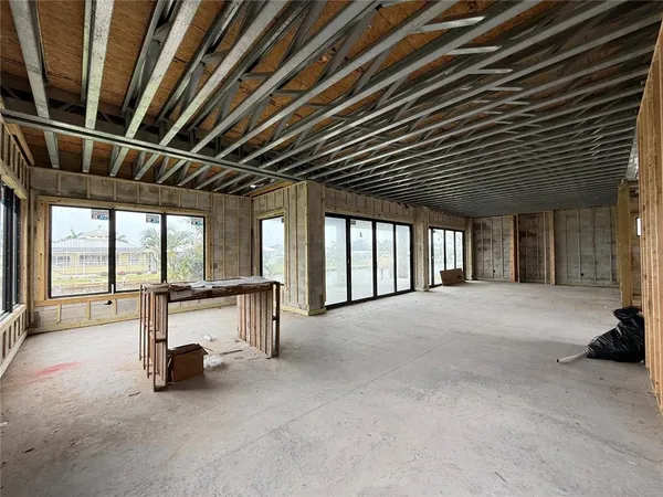 a view of empty room with windows