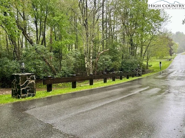 a view of a park with large trees