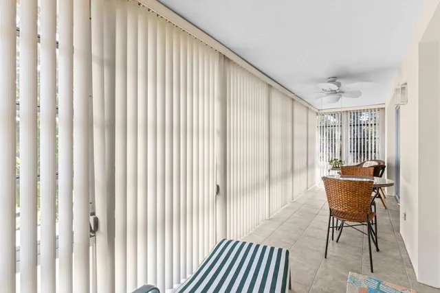 a workspace with wooden floor and a window