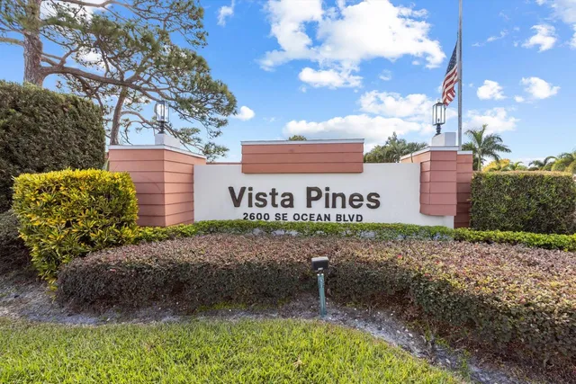 a sign that is sitting in front of a house