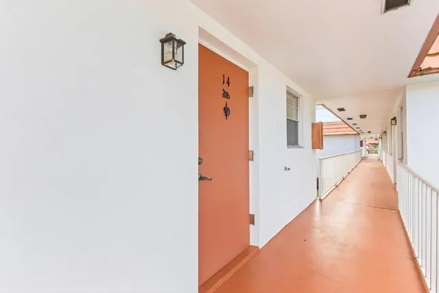 a view of a hallway with staircase