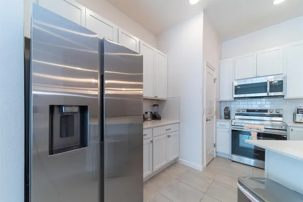a bathroom with a sink a bathtub and a window