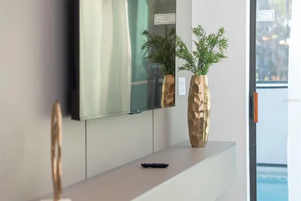 a bedroom with a bed and a lamp