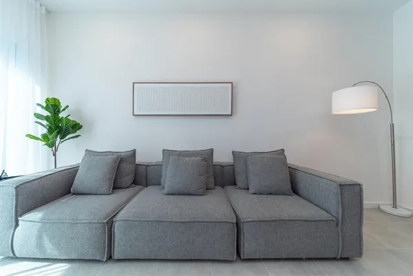 a bedroom with a bed and night stand