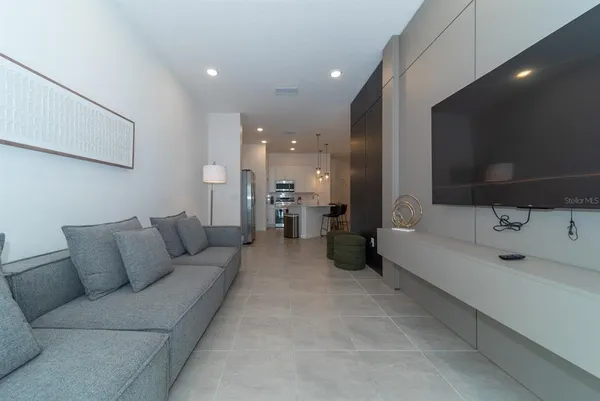 a bedroom with a bed and a couch