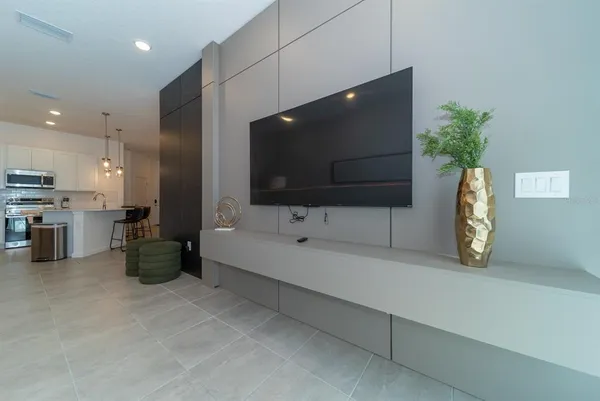 a room that has a rug and white walls