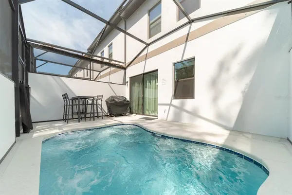a view of a living room with a projector and furniture