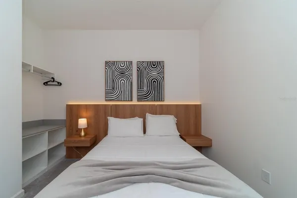 a bathroom with a double vanity sink toilet and a mirror