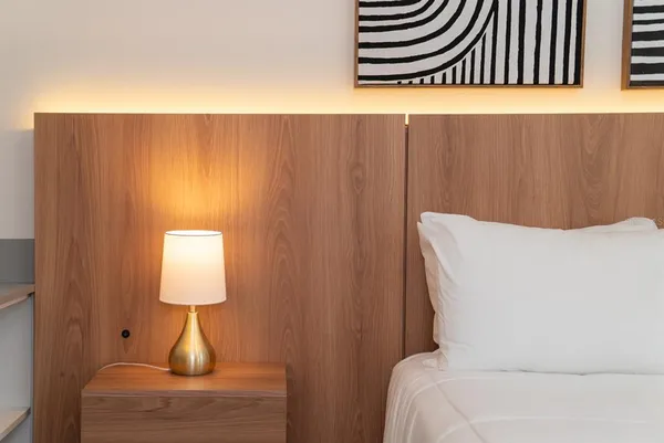 a large white bed in a small room