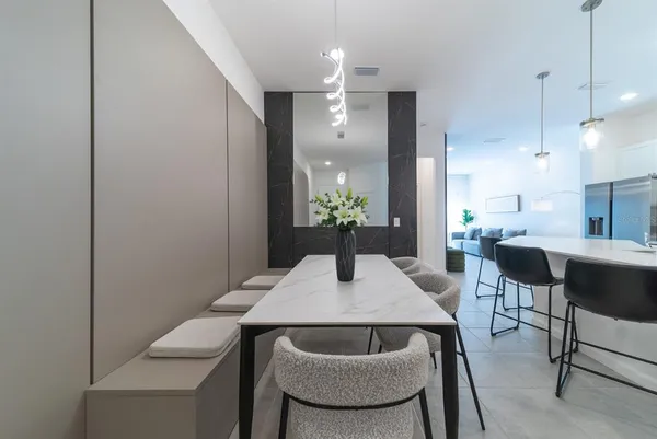 a dining room with furniture and wooden floor