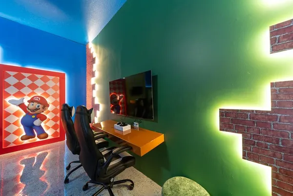 a bedroom with two beds and painted walls