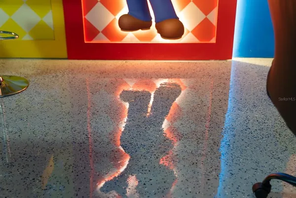 a bedroom with double bed and a mirror