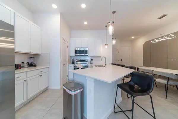 a kitchen with stainless steel appliances cabinets and a sink