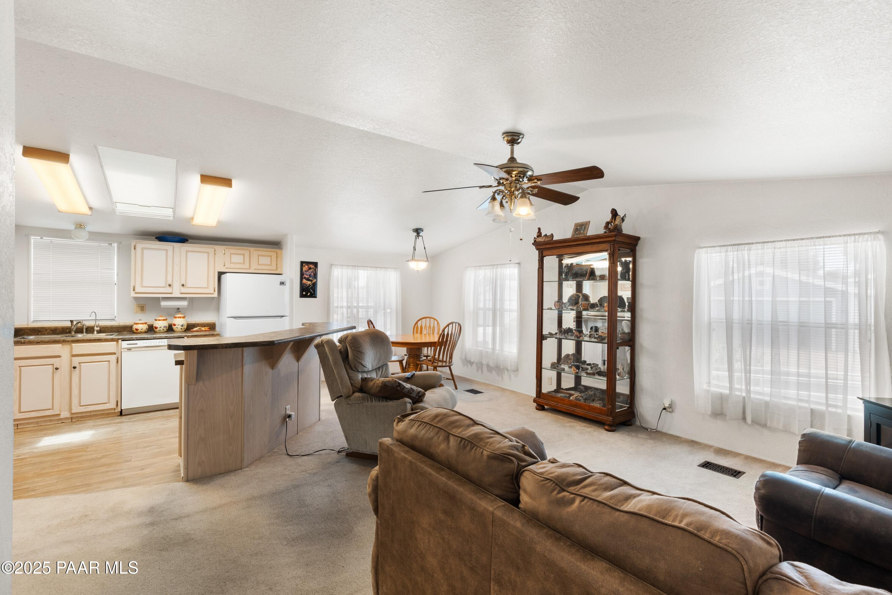 12200 East Obsidian Loop Road Prescott Valley, AZ 86327 - Photo 16 of 23 016_Living Room & Dining Area