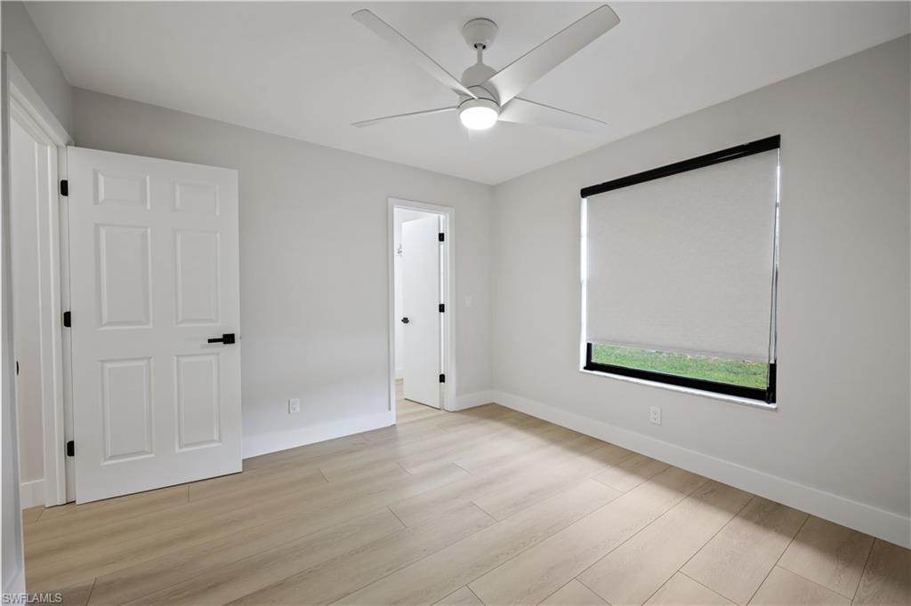 121 Fairway Circle Naples, FL 34110 - Photo 20 of 31 a view of an empty room with a window