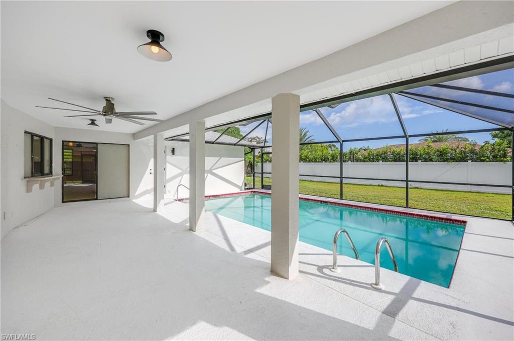 121 Fairway Circle Naples, FL 34110 - Photo 5 of 31 a view of an empty room with a window