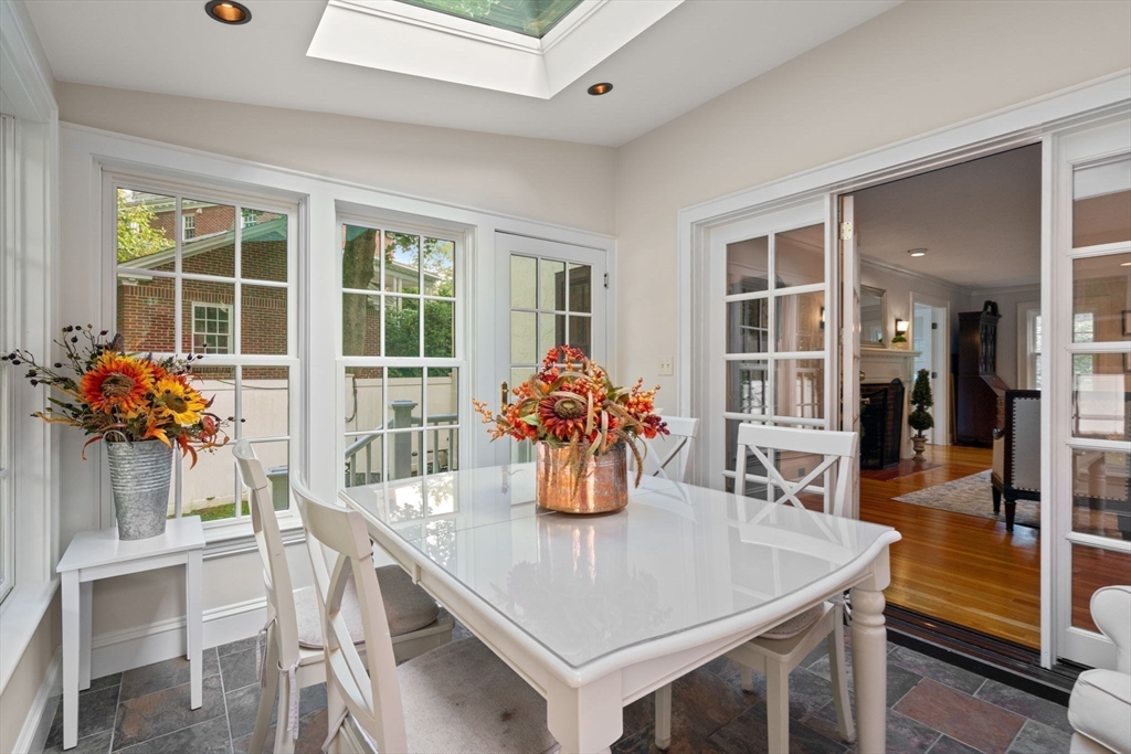 26 Larch Road Newton, MA 02468 - Photo 14 of 34 a dining room with furniture and wooden floor