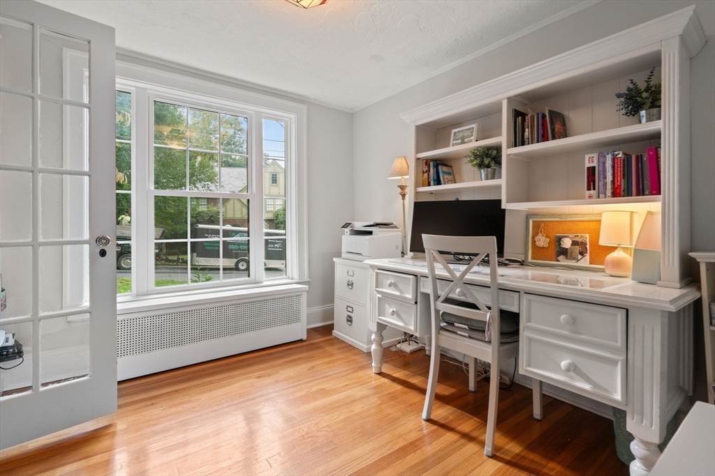 26 Larch Road Newton, MA 02468 - Photo 15 of 34 a workspace with furniture bookshelf and a window