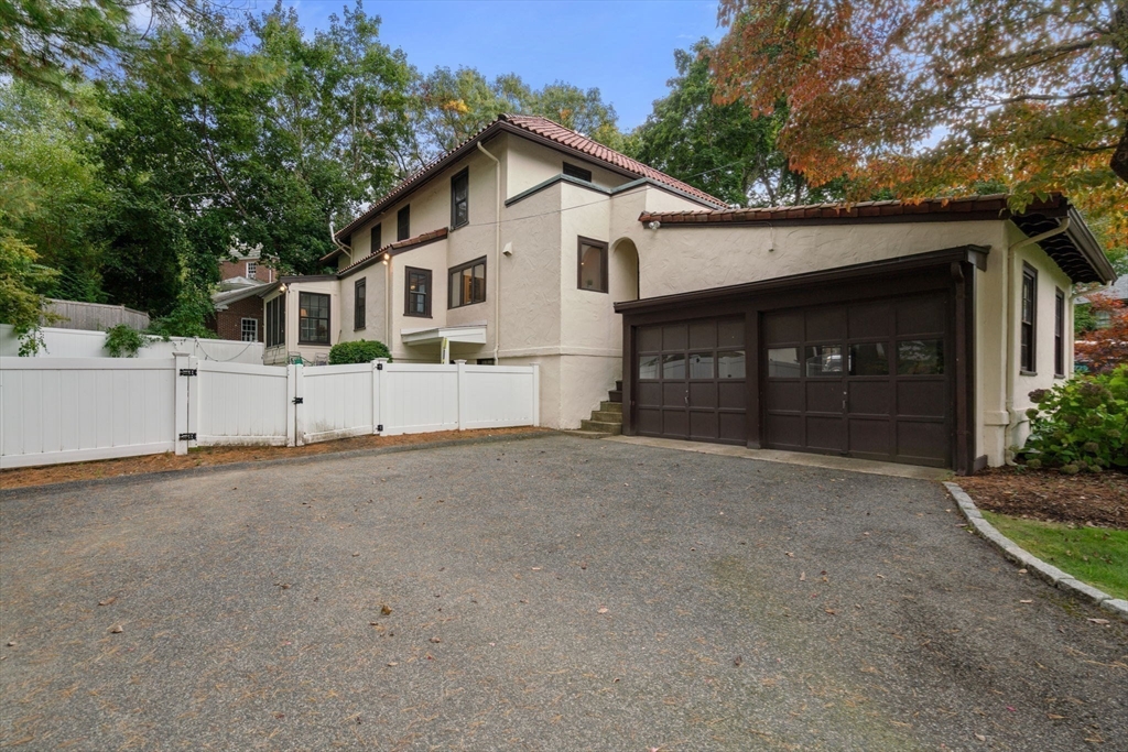 26 Larch Road Newton, MA 02468 - Photo 3 of 34 a view of a house with a yard and garage