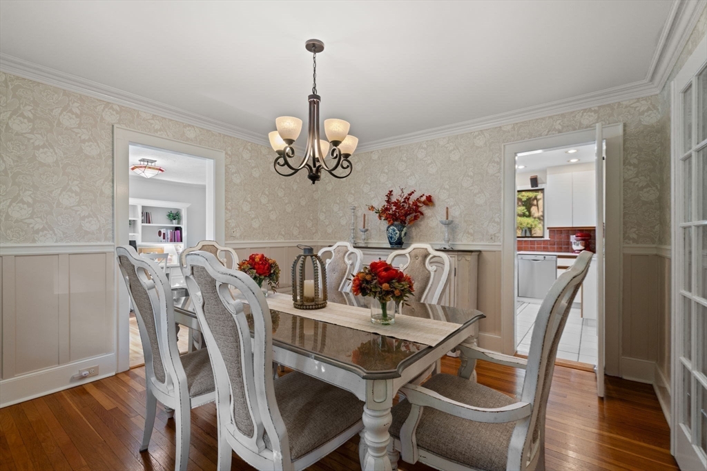 26 Larch Road Newton, MA 02468 - Photo 6 of 34 a view of a dining room with furniture wooden floor and a chandelier