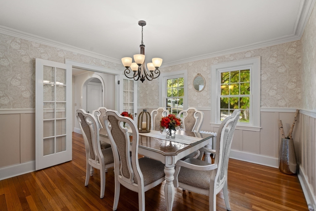 26 Larch Road Newton, MA 02468 - Photo 7 of 34 a view of a dining room with furniture a chandelier and wooden floor